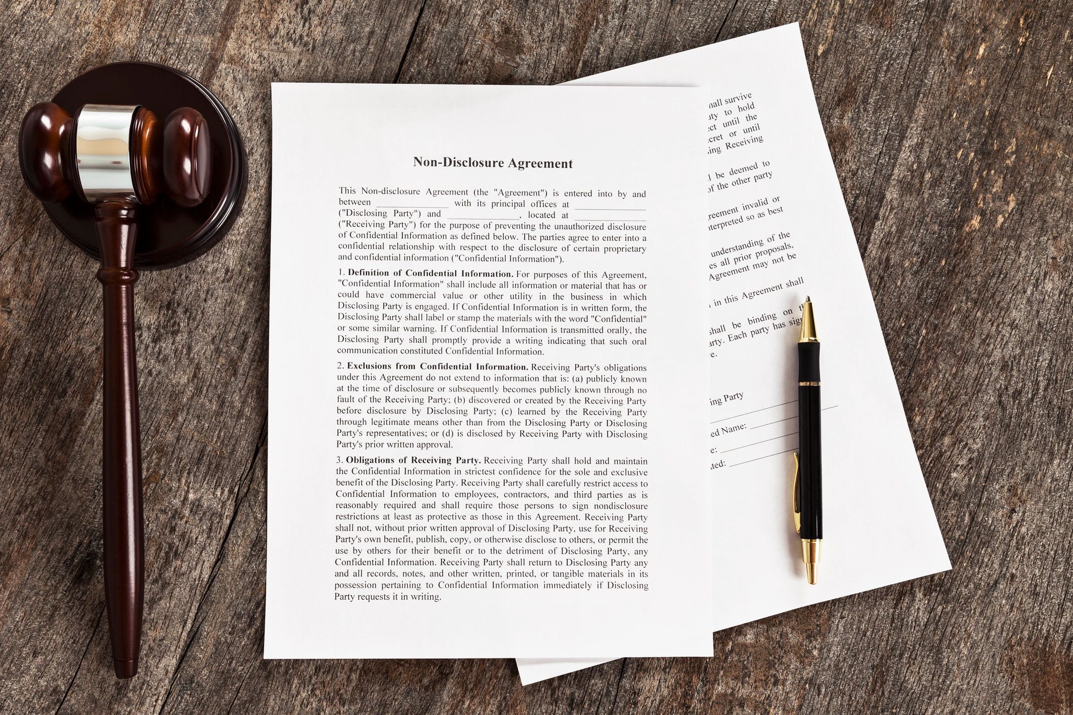Legal documents with pen and gavel
