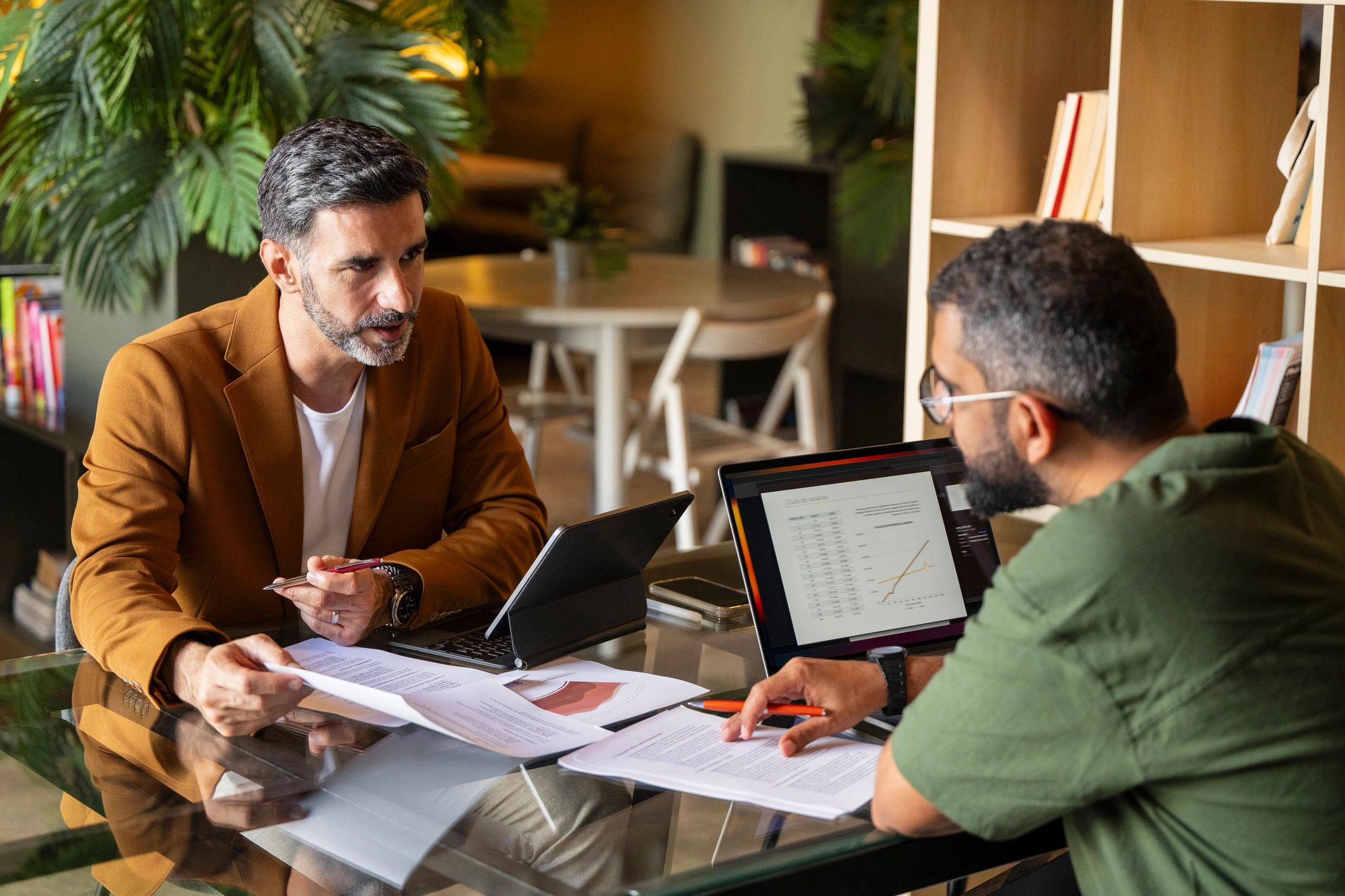Lawyer consultation meeting with documents and laptops
