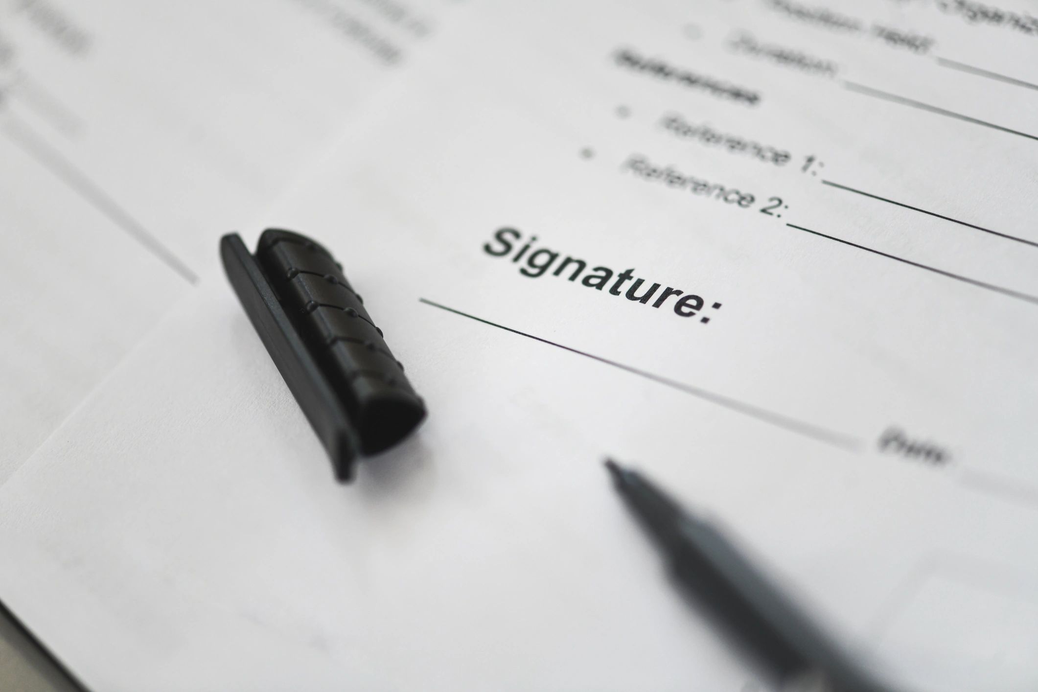 Pen poised to sign a document