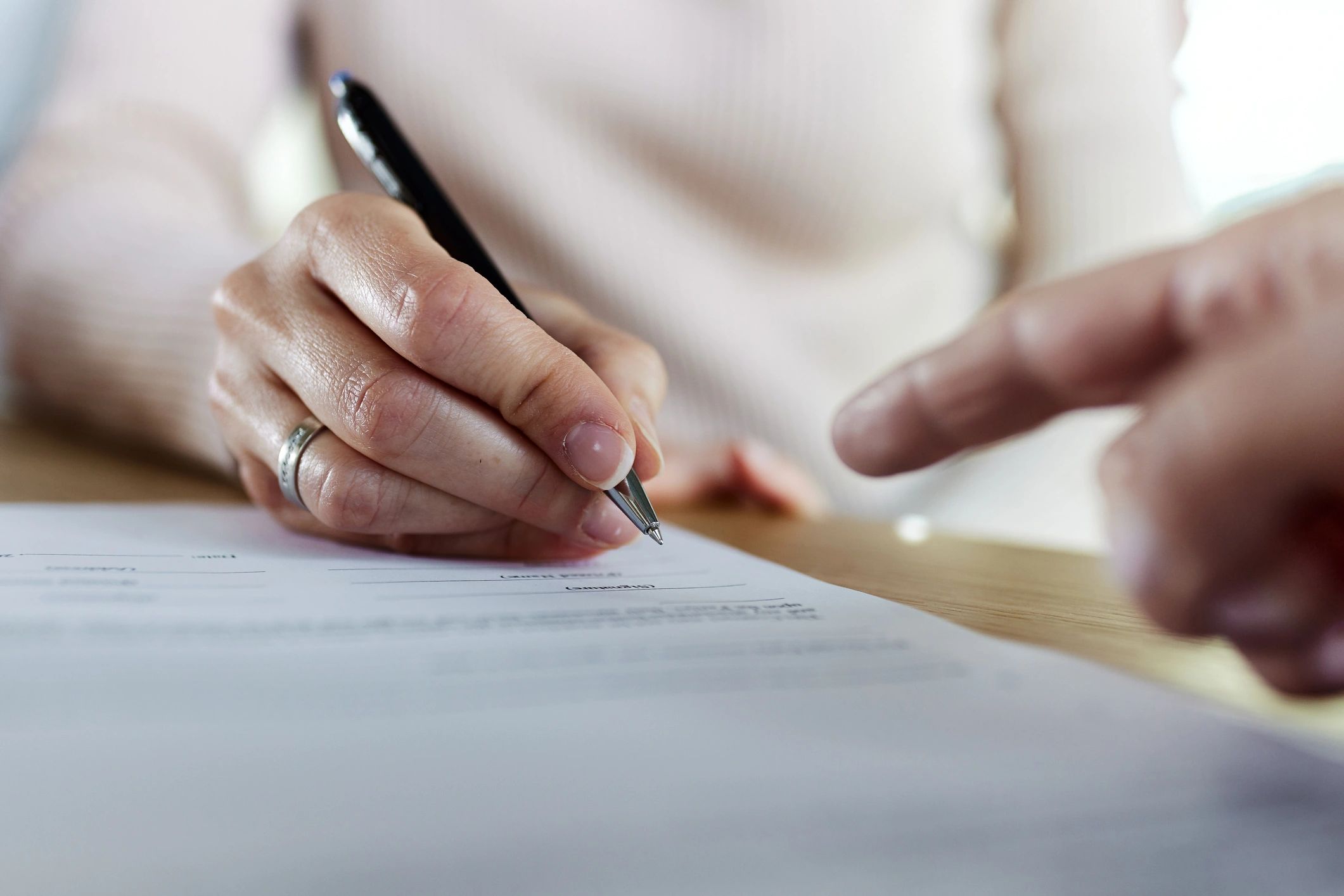 Signing a legal document representing property documentation and verification