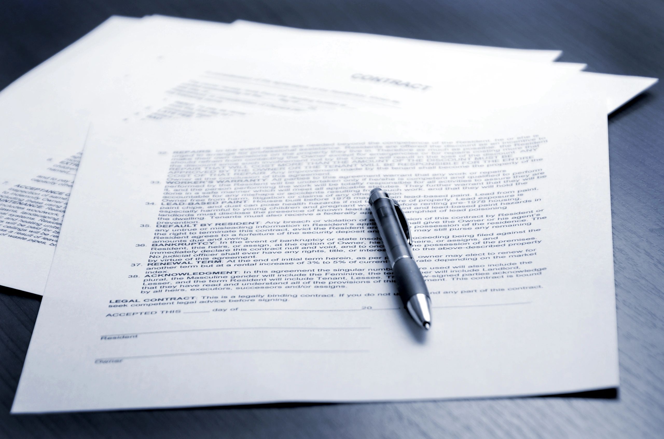 Contract signing on a desk
